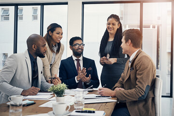 Aufkleber - Just so were all on the same page.... Shot of a group of young businesspeople having a meeting in a modern office.