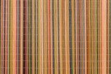 Fototapeta Sypialnia - Multicolored Decorative Braided Wood Stand Linear Wicker Striped Shutter Background Blinds Design