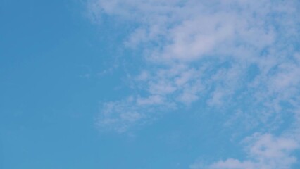 Wall Mural - Full Frame shot of clouds in the blue sky. Natural sky background. Clouds against the blue sky during the noon.	