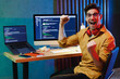 © ViDi Studio - Young fun excited software database engineer IT specialist programmer man in shirt work at home writing code on laptop pc computer do winner gesture clench fist celebrate. Program development concept.