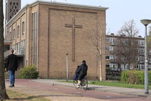 Amsterdam Bos En Lommer District Street View With Church Brick Facade With Cross And People, Netherlands