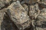 Fototapeta  - Quartz crystals in stone, close-up. Raw quartz in a mine in stone.