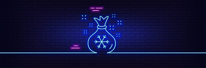 Wall Mural - Neon light glow effect. Santa sack line icon. Christmas or New year sign. Bag with gifts and presents symbol. 3d line neon glow icon. Brick wall banner. Santa sack outline. Vector