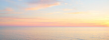 Baltic Sea At Sunset. Dramatic Sky, Blue And Pink Glowing Clouds, Soft Golden Sunlight, Midnight Sun. Picturesque Dreamlike Seascape, Cloudscape, Nature. Panoramic View