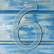 number six on wooden blue background photo