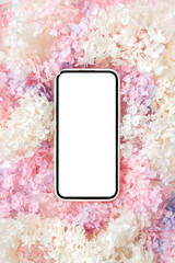 Wall Mural - smartphone mockup with pink and white flowers. device screen mock up on stylish background for prese