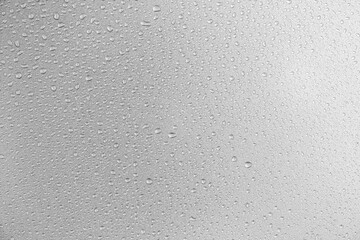 Poster - Water droplets on gray background covered with water droplets, bubbles in water.