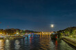 White Full Moon Over Paris Touristic Center at Night With Seine River