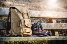 Hiking Gear. Retro Backpack And Hiking Boots On A Wooden Bench. Bavarian Forest, Germany.