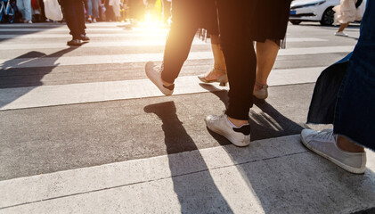 Shadows of people on the crosswalk