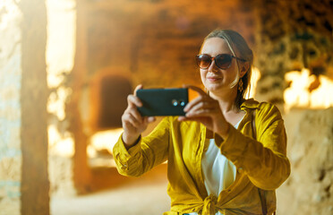 Poster - Woman visiting Tombs of the Kings in Paphos.