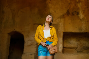 Poster - Woman visiting Tombs of the Kings in Paphos.