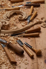 Sticker - Woodworking tools. Carving wood with chisel. Carpenter's hands use chiesel. Carpenter wood carving equipment. Woodworking,