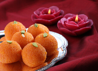 Wall Mural - Diwali Sweets besan and motichur Laddu Indian traditional sweet served in a  plate