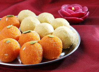 Wall Mural - Diwali Sweets besan and motichur Laddu Indian traditional sweet served in a  plate