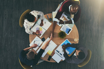 Poster - Adding new creative talent to their project. High angle shot of businesspeople shaking hands during a meeting with colleagues.