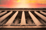 Fototapeta Nowy Jork - Classical columns on government building with colorful sky