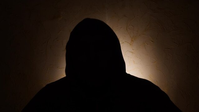Fototapete - Silhouette of unknown male person over dark 