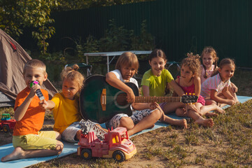 Wall Mural - the children have a great time together in the backyard