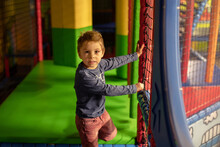 Child Plays In Play Center
