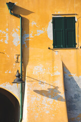 Wall Mural - old facade of a house in the small sea village of Variotti, in Liguria, Italy