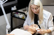 © Ihor - Cosmetic facial skin care procedure in the cosmetologist's office for a woman
