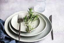 Overhead View Of A Place Setting With A Sprig Of Fresh Rosemary