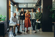 © Jacob Lund - Diverse business team smiling at the camera in an office
