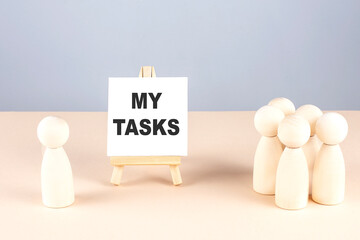 Poster - MY TASKS text on easel with wooden figure, meeting concept