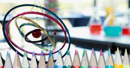 Poster - Composite video of multiple colored pencils against empty laboratory at school