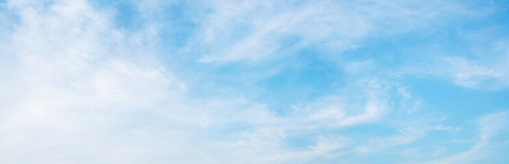 Wall Mural - abstract white puffy clouds and blue sky background.
