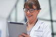 © Micah C/peopleimages.com - Live appointments have been a brilliant work around. Shot of a mature female doctor using a tablet.