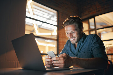 Poster - I can finally book that taxi home. Shot of a handsome young man working late in his office.