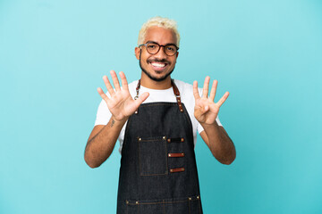 Canvas Print - Restaurant Colombian waiter man isolated on blue background counting nine with fingers