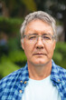 © WavebreakMediaMicro - Portrait of confident caucasian senior man with eyeglasses in backyard on weekend