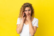 © luismolinero - Young blonde woman using mobile phone isolated on yellow background thinking