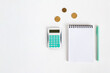 Illustration of counting money. Notepad with calculator and coins on a white background.