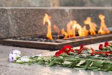 Soviet Soldiers WWII Memorial In Russia. Flowers Lay At An Eternal Flame