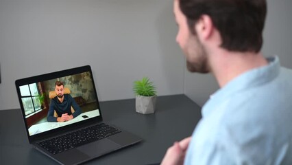 Wall Mural - Virtual conference, webinar. Young caucasian man waves hello to his male colleague or tutor on the laptop screen. Technologies concept