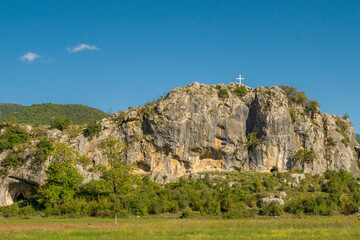 Cross on the background of mountain peaks