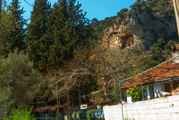 Wall Mural - DALYAN, TURKEY: Lycian tombs carved into the rock in the ancient city of Kaunos.