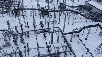 Wall Mural - Aerial view of a high voltage electrical substation in winter season.
