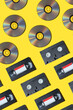pattern with a VHS video cassette, Golden compact disc, Outdated technology background.