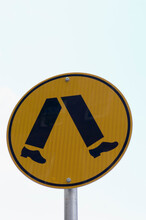 Close-up Of A Pedestrian Crossing Sign