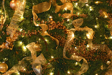 Close-up Of Christmas Ornaments Hanging On A Christmas Tree
