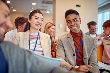 Young mutiethnic colleagues listening to a seminar