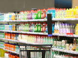 Fototapeta  - choosing detergents, toilet paper in supermarket.empty grocery cart in an empty supermarket