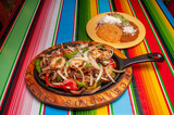Fototapeta Na ścianę - Mexican Shrimp Steak and Chicken Fajitas