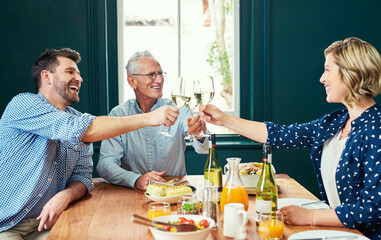 Poster - The meal was extraordinary. Shot of a cheerful family sharing a celebratory toast together while being seated around the dinner table at home.