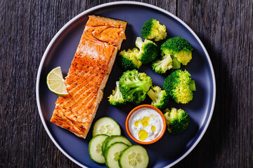 Wall Mural - roast salmon fillet with boiled broccoli and sauce